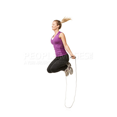 Buy stock photo An attractive young woman skipping with a smile on her face