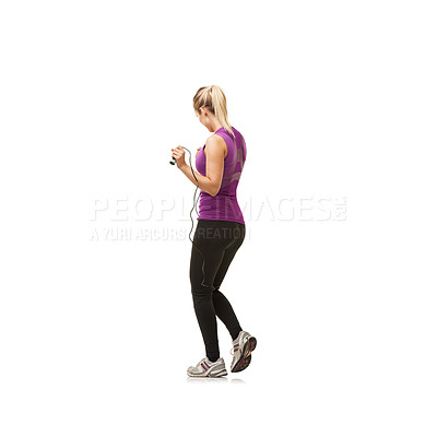 Buy stock photo Rearview shot of a woman holding a skipping rope