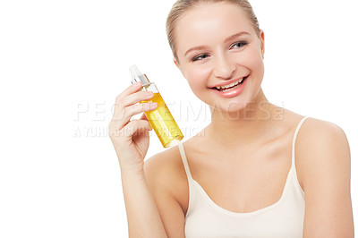 Buy stock photo Woman, makeup and face with beauty product, smile and model for scent, cosmetics on white background. Skin, fragrance and bottle with shine, skincare or clean for glow, cosmetology or grooming
