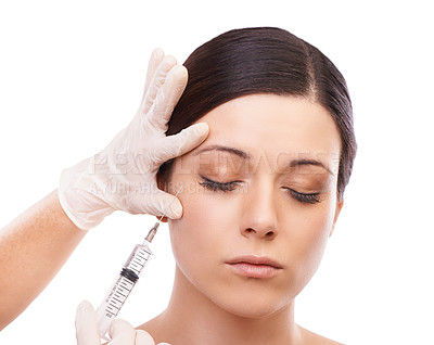 Buy stock photo A lovely young woman getting a botox injection in her face