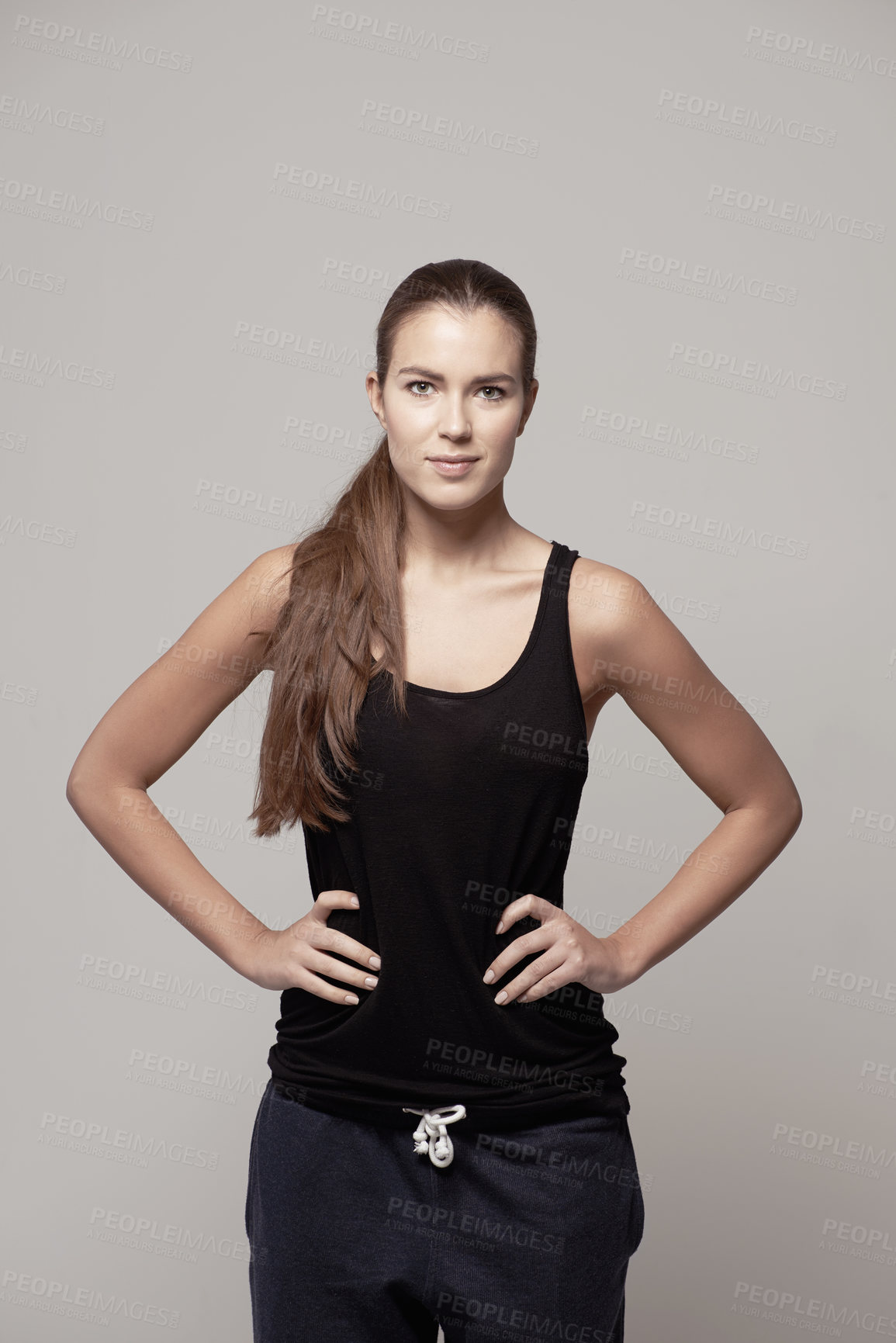 Buy stock photo Woman akimbo, portrait and fitness confidence with arms on hip for body, health or wellness on a gray studio background. Happy and confident female person or model posing in cardio exercise clothing