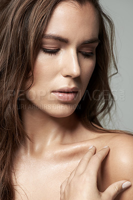 Buy stock photo Cropped shot of a beautiful young woman against a gray background