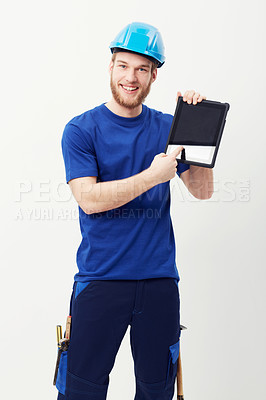 Buy stock photo Portrait of a happy young man showing you a digital tablet