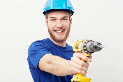 Buy stock photo Construction man, portrait and power drill in hand, studio and maintenance by white background. Person, employee or small business owner with tools, helmet or happy for job at repair services company