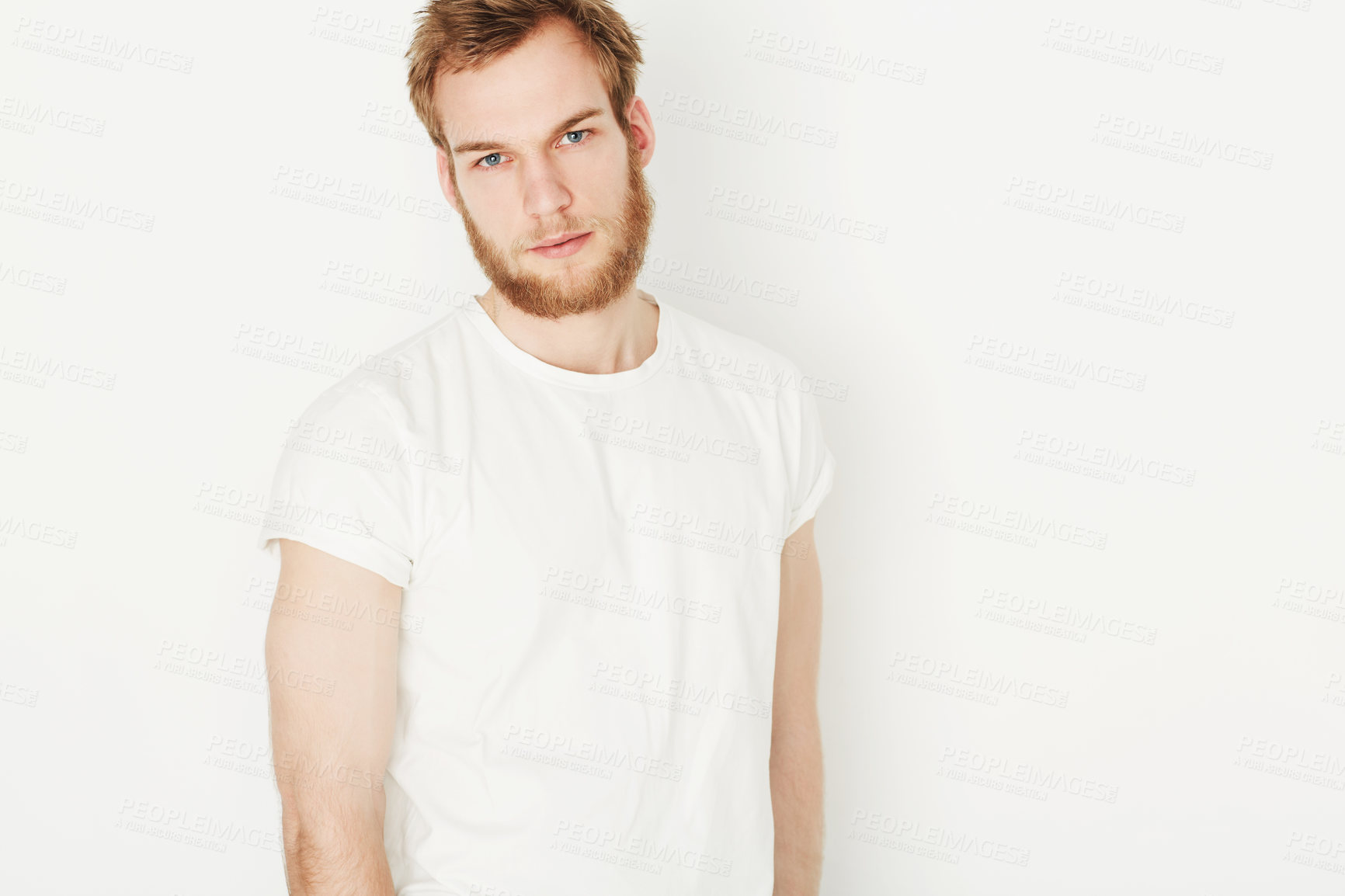 Buy stock photo Portrait of a young man wearing a white t-shirt