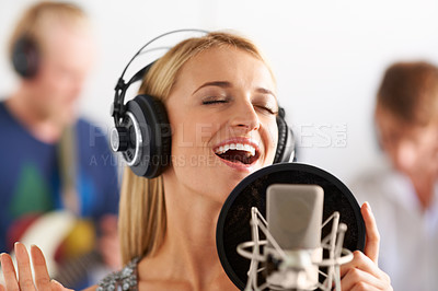 Buy stock photo Music, voice and woman with microphone, headphones and band performance with singing talent. Recording studio, art and girl musician live streaming song for record label, sound and happy audio singer