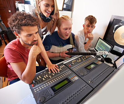Buy stock photo Recording studio, music and people with producer for band songs, track and audio with musical instruments. Technology, soundboard and men and women with sound engineer or technician to record media