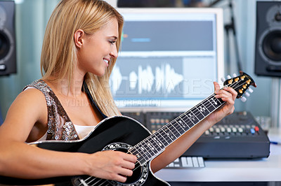 Buy stock photo Woman, guitar and computer in recording studio for music with smile, ideas and creativity for art, album or song. Musician, artist and instrument with pc for sound, audio and happy for entertainment