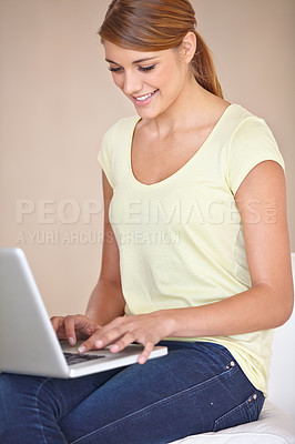 Buy stock photo Happy, woman and typing on laptop in home to update blog post, social media and digital subscription for remote work. Freelancer, smile and computer for online shopping, email or research on internet