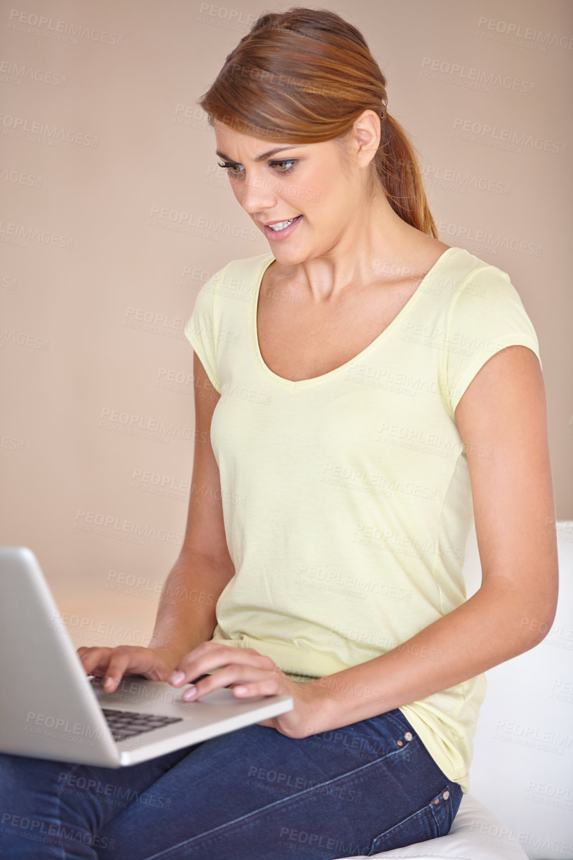 Buy stock photo Woman, laptop and typing on sofa for remote work, reading blog post and social media subscription at home. Freelancer at computer for online shopping, elearning research and digital download on couch