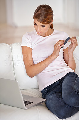 Buy stock photo Woman, laptop and filing nails on sofa in living room for social media, communication or networking at home. Attractive young female person cleaning hands with computer in relax on couch at house