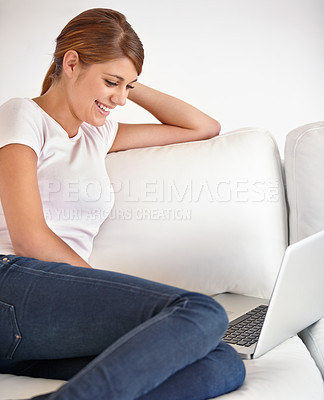 Buy stock photo Woman, laptop or smile in home on sofa to watch movies, digital subscription or streaming multimedia in living room. Computer, online shopping or relax to update blog post, social network or internet