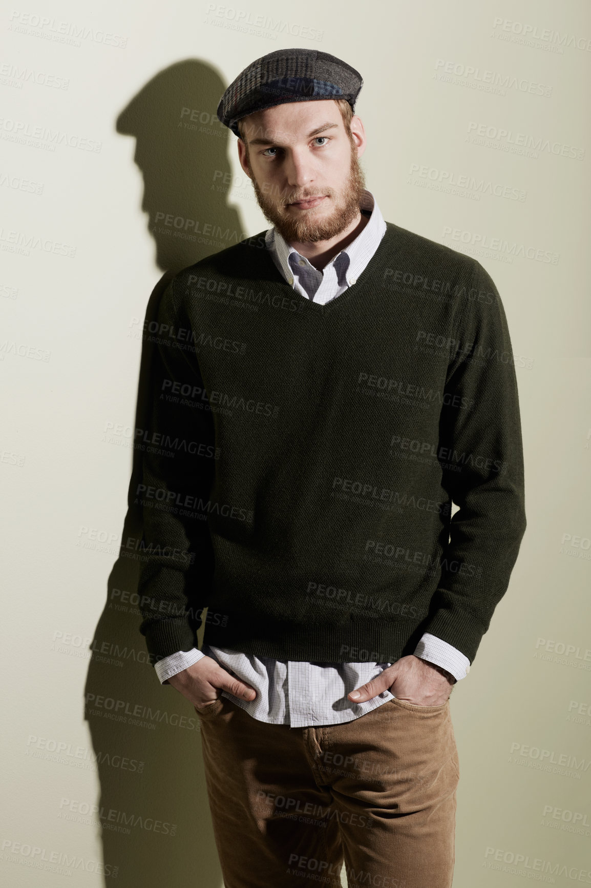 Buy stock photo Fashion, confidence and portrait of man with style, trendy clothes and cool outfit on wall background. Aesthetic, model and face of serious person with pride, attractive and handsome in studio