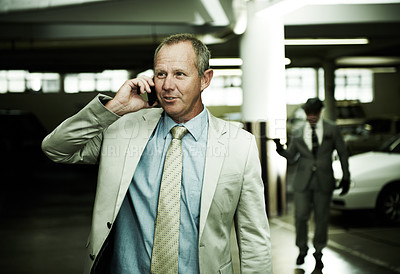 Buy stock photo Man in parking, phone call and criminal following with gun, danger and walking in basement. Crime, kidnapping and person in garage talking on cellphone with cars, scary thief or gangster in shadow.