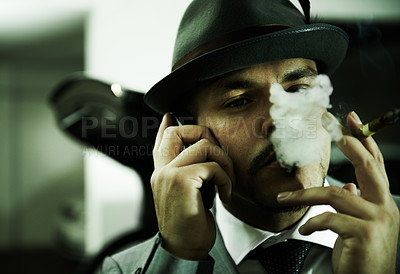 Buy stock photo Man, gangster and phone call while smoking or planning mafia, danger or ransom abduction. Male person, cigar and mobile device or hitman conversation for robbery violence, interrogation or terror