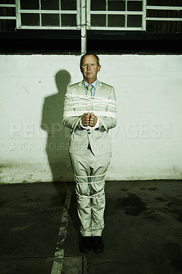 Buy stock photo Man, business and rope kidnapping for crime corporate professional for ransom, hostage or criminal terror. Male person, tied up bondage and mafia abduction for victim danger, parking lot or night