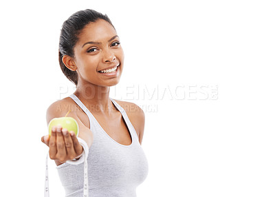 Buy stock photo Woman, portrait and lose weight with a measuring tape and apple in white background, studio or mockup. Happy, model and healthy food for results in fitness, wellness and diet with nutrition and fruit