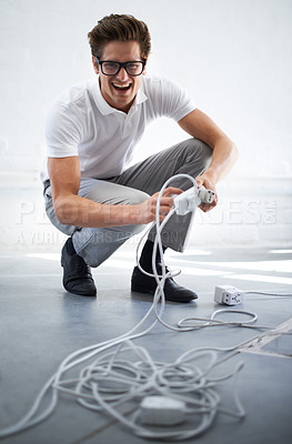 Buy stock photo Portrait, electrician or man on cable connection, power and electricity in office. IT, technician and person plug wire, funny engineer and technology professional, geek and excited nerd in glasses