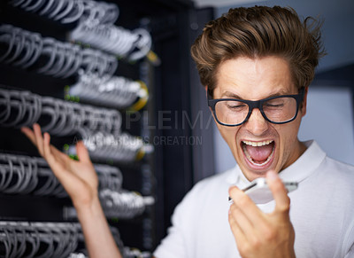 Buy stock photo Server room, man and angry on phone call for cable, talk or glitch in network, cybersecurity or frustrated in night. Technician, person and cellphone for connection, question or report system fail