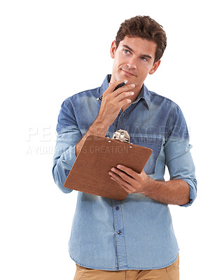 Buy stock photo A pensive young man holding a clipboard