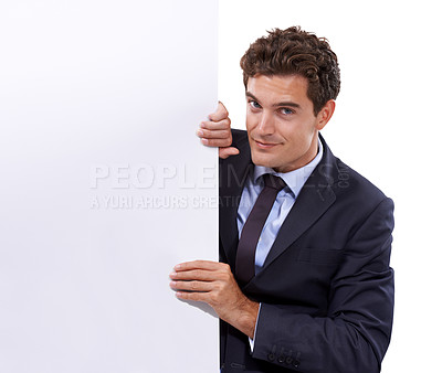 Buy stock photo Banner, portrait and business man with mockup in studio for news, guide or advertising space on white background. Poster, face and male entrepreneur with recruitment presentation, checklist or offer