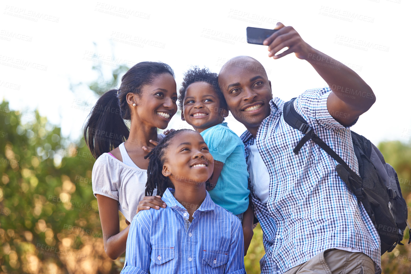 Buy stock photo Happy black family, selfie and photo in nature for hiking, bonding or outdoor photography together. African mother, children and father smile taking picture or photograph for adventure in forest