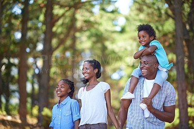 Buy stock photo Cute african american family spending time out in nature together