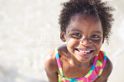 Buy stock photo Wet, happy child and portrait on beach sand, swimsuit and summer holiday with sunshine in nature. Black, young girl and smile face for swim on vacation, cape town and ocean for wellness in outdoor