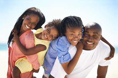 Buy stock photo Black family, parents and kids with piggyback on beach for adventure, holiday or vacation in summer. African people, face or smile outdoor in nature for break, experience or bonding with relationship