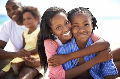Buy stock photo African family, parents or children and hug at beach for adventure, holiday or vacation in summer. African people, face and smile outdoor in nature for embrace, experience or bonding and relationship