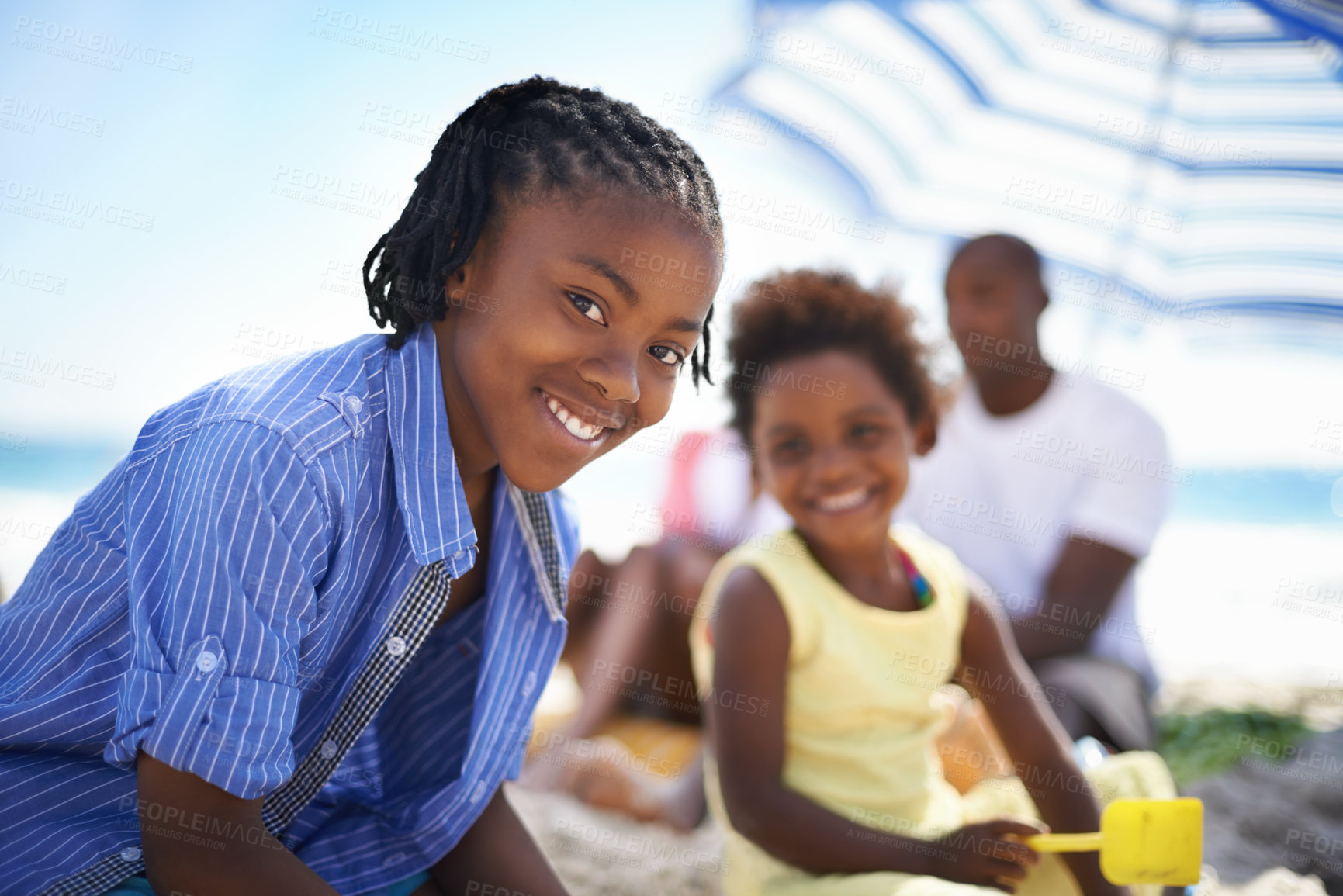 Buy stock photo Portrait, black person and child on beach with family for adventure, holiday or vacation in summer. African kid, face and smile outdoor in nature for break, experience or bonding with relationship