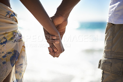 Buy stock photo Love, zoom and couple holding hands at a beach with love, respect and trust, bonding and commitment. Support, closeup and people in nature with kindness, security and solidarity on honeymoon vacation