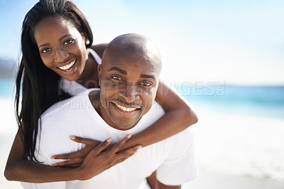 Buy stock photo Piggyback, smile and portrait of black couple at the beach for valentines day vacation, holiday or adventure. Happy, love and African man and woman on a date by the ocean on weekend trip together.