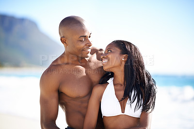Buy stock photo Happy, love and young black couple at the beach for valentines day vacation, holiday or adventure. Smile, romance and African man and woman on a date by the ocean or sea on weekend trip together.