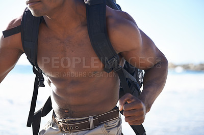 Buy stock photo Backpack, running and muscular black man on beach for workout, exercise or outdoor cardio by ocean coast. Closeup of African male person on run with bag for adventure or training by the sea in nature