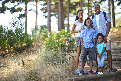 Buy stock photo Portrait, smile and hiking with a black family in nature together for travel, freedom or adventure. Mother, father and children outdoor in the forest, environment of woods for summer bonding