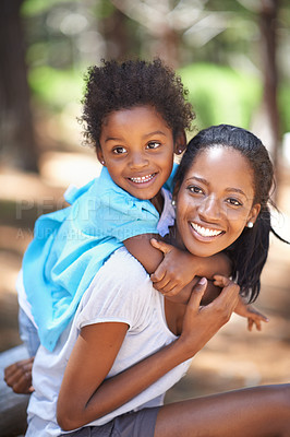 Buy stock photo Child, happy mother in portrait and piggyback outdoor, care or bonding together. Face, African mom carrying kid and smile in nature, family play in forest or park, love of parent and summer vacation