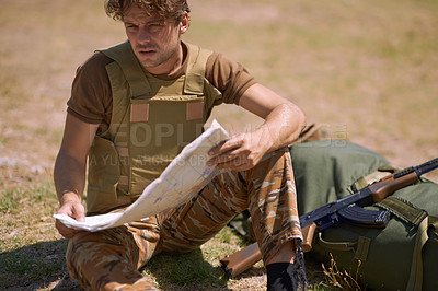 Buy stock photo Soldier with map outdoor, planning battle route or tactical operation goals for mission in war. Man on battlefield or at military base camp, check strategy paperwork with army target and attack