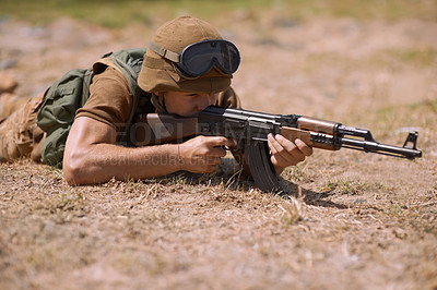 Buy stock photo Military, sniper and shooting with man and gun in nature for war, conflict and patriotism. Army, surveillance and security with person and aim with rifle training for soldier, battlefield and veteran