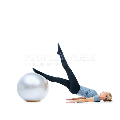 Buy stock photo Woman, exercise ball or legs balance in studio for workout performance, wellness or white background. Flexible female athlete, training equipment or fitness for mockup space, challenge or stretching