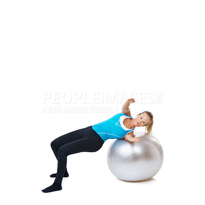Buy stock photo Portrait, fitness and happy woman stretching on an exercise ball in studio on white background. Gym, mockup and female person with inflatable for flexibility, training or balance, sports or workout