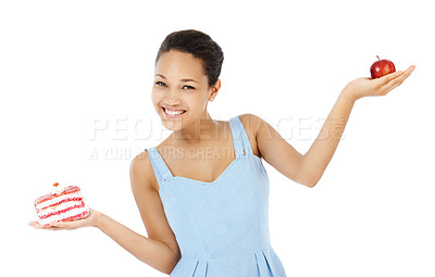 Buy stock photo Happy woman, apple and cake for healthy food choice, balance and diet decision in studio. Portrait of young person or model and red fruit versus cream dessert in palm for health on a white background