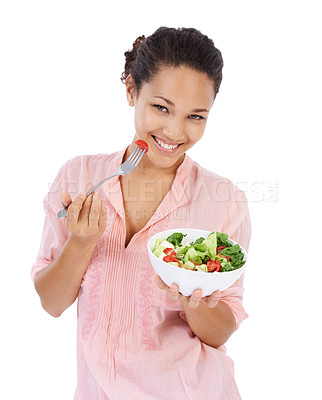 Buy stock photo Young womanl smiling while eating a fresh green salad