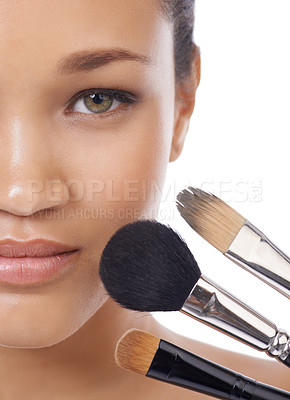 Buy stock photo Makeup, brushes and portrait of young woman in studio for beauty, foundation and cosmetics. Face of a model, MUA artist and person with skincare, application tools and product on a white background