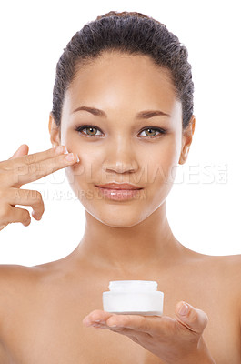 Buy stock photo Young woman, portrait and beauty cream, skincare and cosmetics on a white background. Face of an African model or person with moisturizer application, skin care product and dermatology in studio
