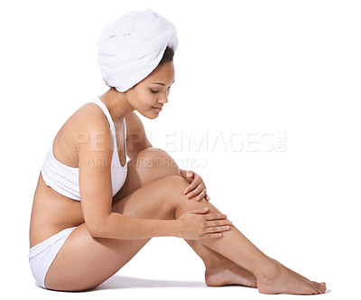 Buy stock photo Young woman, legs and skincare in studio for hair removal results, self care and beauty on floor on a white background. Happy person or model in underwear and body cosmetics, skin care or dermatology