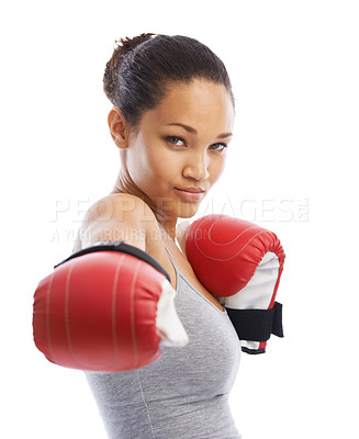 Buy stock photo A beautiful young woman wearing boxing gloves