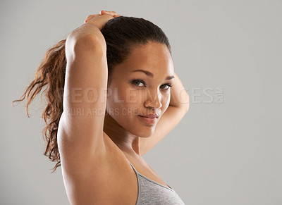 Buy stock photo Fitness, tie hair or portrait of model isolated on grey background for wellness or sports. Woman, ponytail or person with natural hairstyle ready to start exercise, training or workout in studio