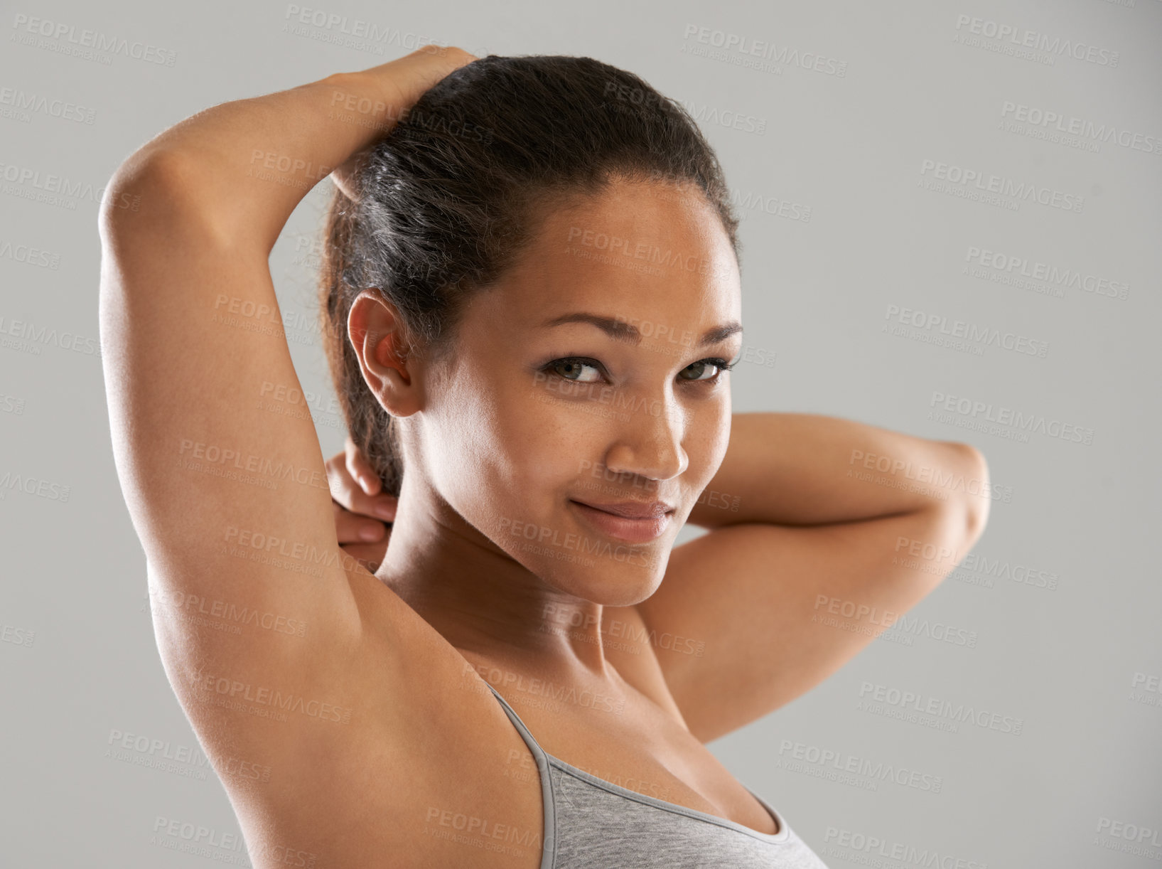 Buy stock photo Fitness, tie hair or portrait of happy woman isolated on grey background for wellness or sports. Smile, female athlete or person with hairstyle ready to start exercise, training or workout in studio