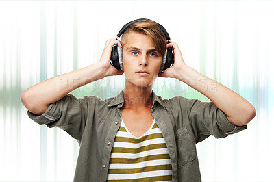 Buy stock photo Man, portrait and DJ with headphones or audio waves listening to music against a studio background. Young male person or sound artist with headset in rhythm for podcast, beat or radio track on mockup